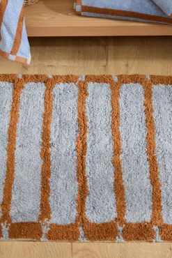 Alfombra de baño a rayas azules Saturno