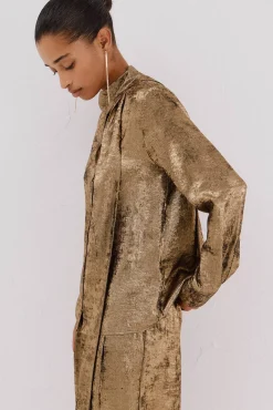 Blusa lazo efecto dorado