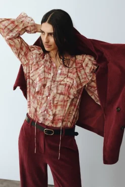 Blusa volante delantero