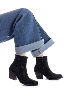 Botín cowboy tachas