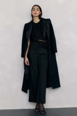 Chaleco de punto bordado flecos