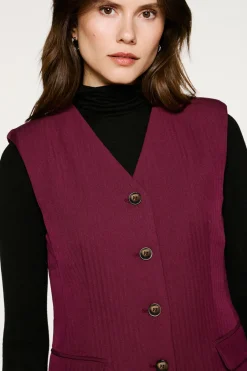 Chaleco traje bolsillos.