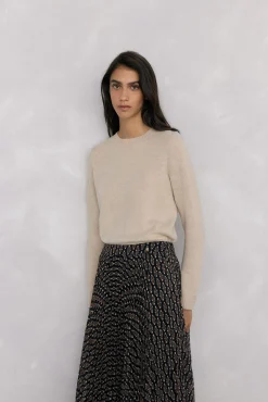 Doble prenda jersey y capa con detalle volante