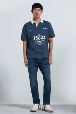 Jeans en knit denim sobretintado slim fit