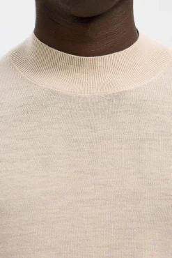 Jersey cuello mock 100% lana merino.