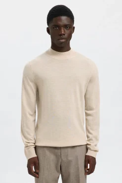 Jersey cuello mock 100% lana merino.