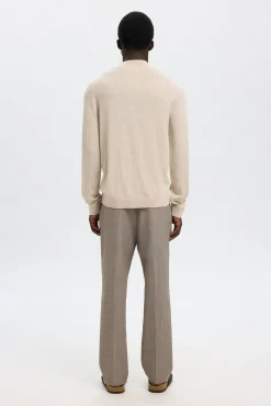 Jersey cuello mock 100% lana merino.