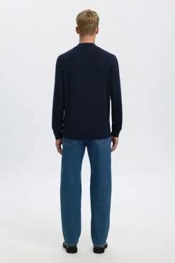 Jersey cuello mock 100% lana merino.