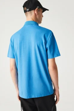 Polo con bordado de cocodrilo pespunteado