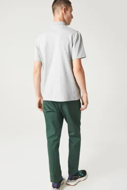 Polo con bordado de cocodrilo pespunteado