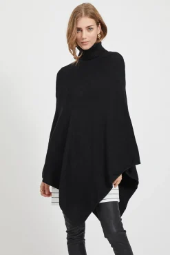 Poncho de punto con cuello vuelto