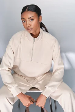 Sudadera cuello cremallera beige